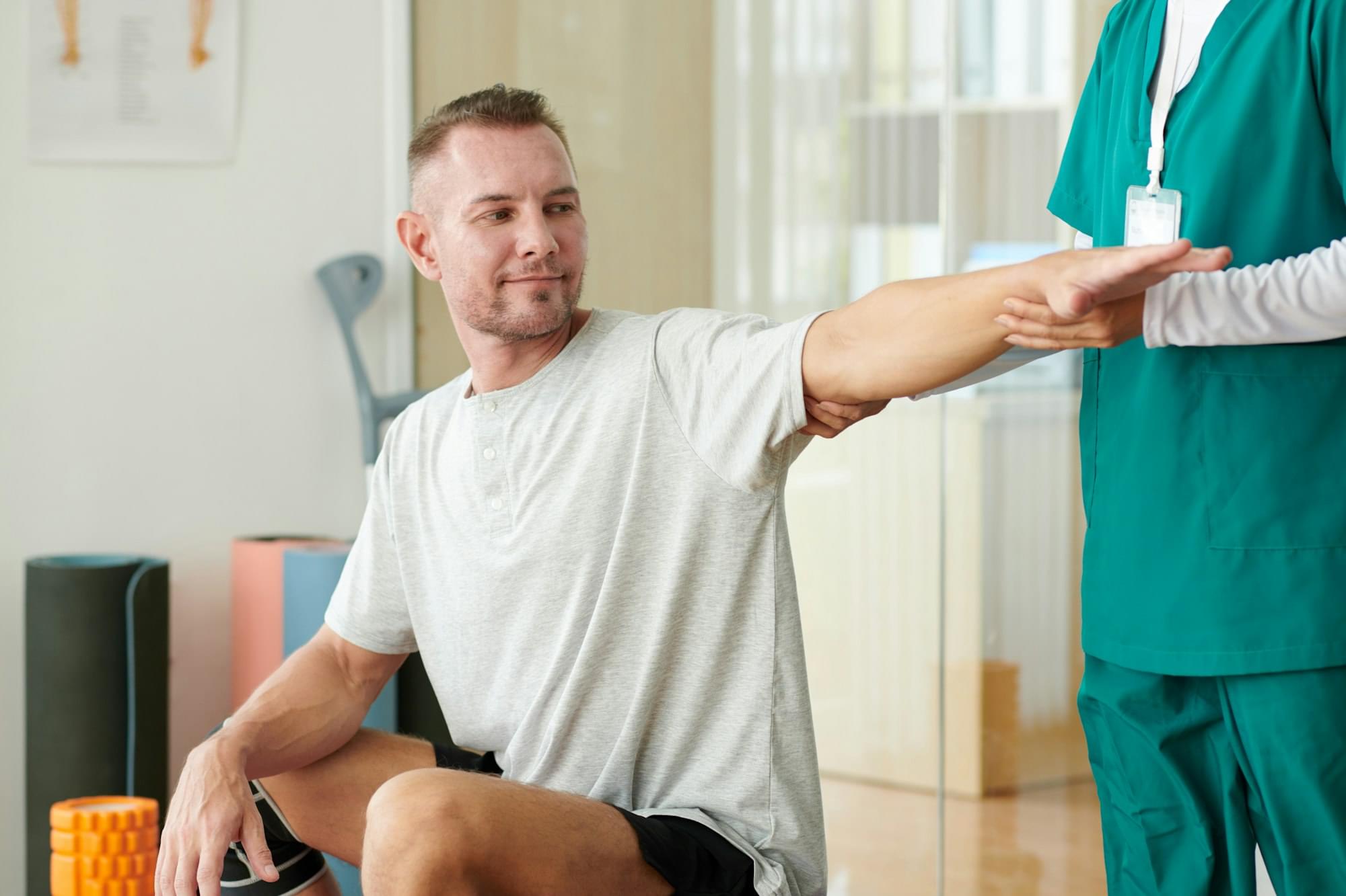 Nurse Asking Patient to Extend Arm