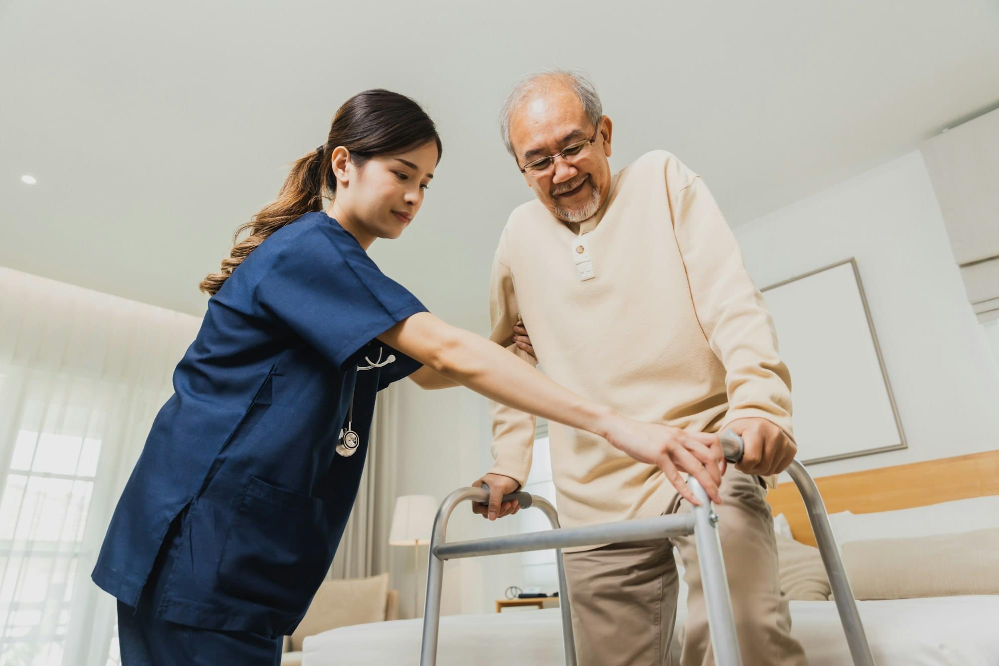 Elderly patient physiotherapy nurse exercising and try to walk