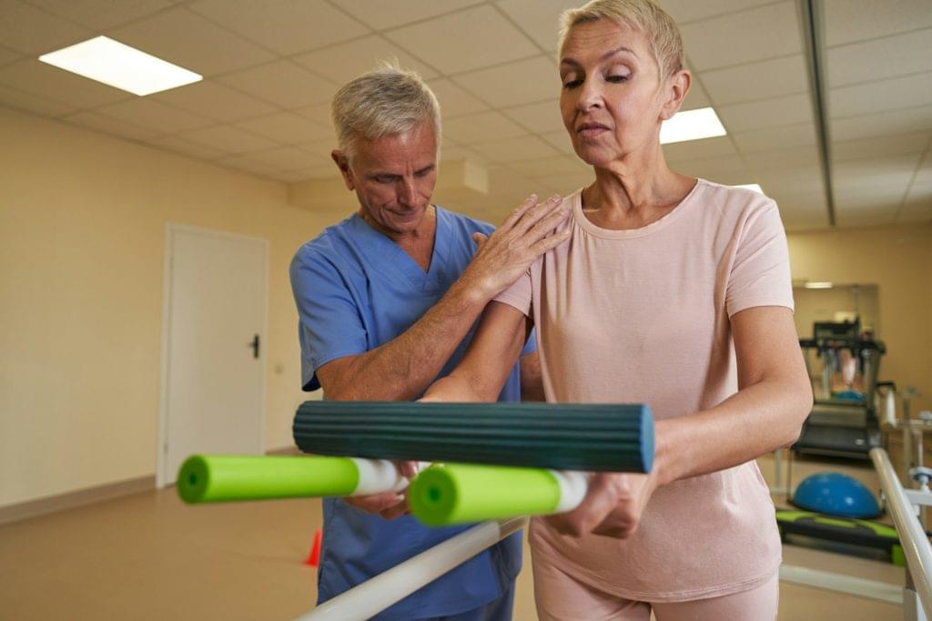 Mature woman during physical therapy in rehab center