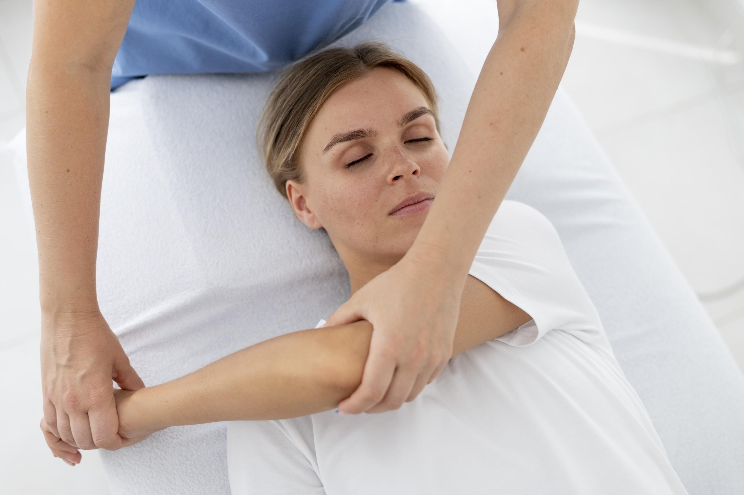 physiotherapist-helping-young-female-patient
